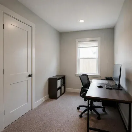 Finished home office wall after soundproofing, with no sign of the assembly behind it