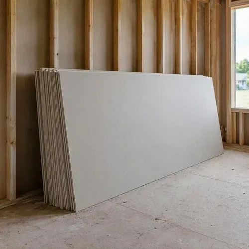 New drywall sheets delivered and stacked in an empty room before board hanging starts